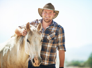 Portrait, farmer and man with horse, summer and countryside with nature, happiness and smile....