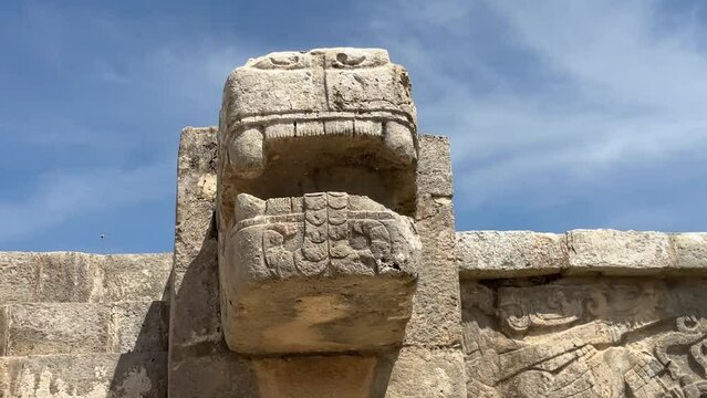 Closeup footage of the snake head on Venus Platform in Chichen Itza in Tinum, Yucatan, Mexico