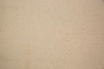 a light brown cardboard background with a few stains of food
