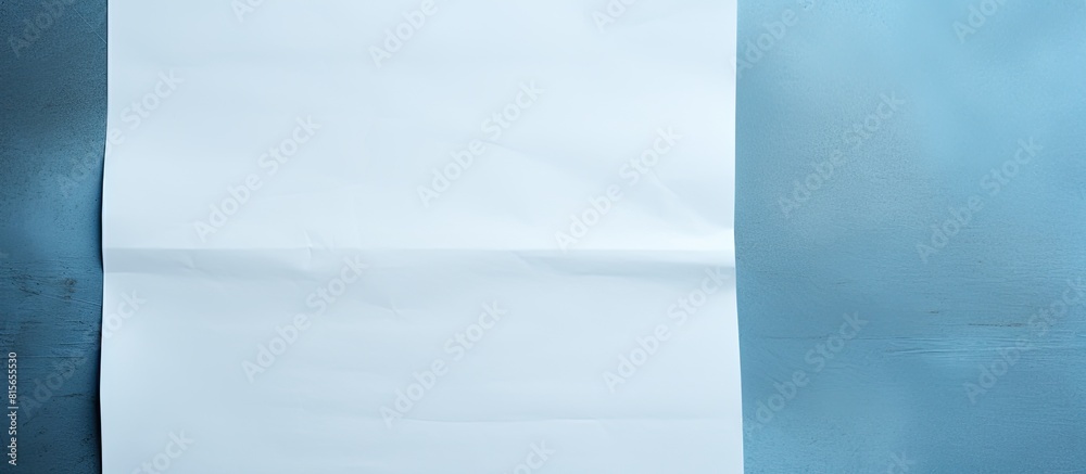 Aufkleber a white sheet of paper with copy space image on a blue textured background