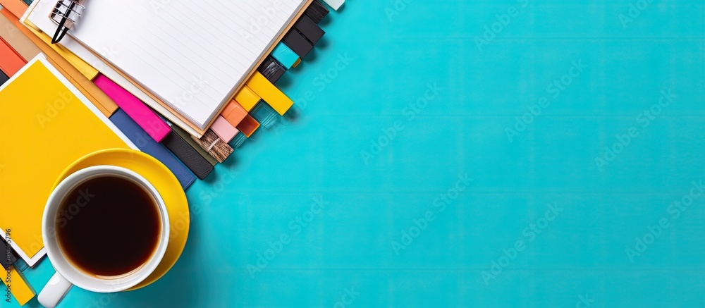 Poster top view of a coffee cup surrounded by copybooks on a colorful background perfect for incorporating 