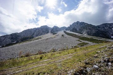 Begunjščica panorama of mountain trekking to the highest peak. View of the Alps, climbing with via ferrata. Distant view of Lake Bled from above. Sports holidays, life of adventure in the countryside.