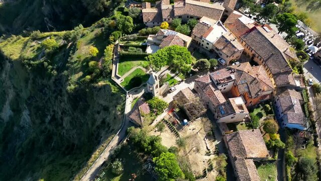 High drone footage of the medieval coastal village of Fiorenzuola di Focara in Pesaro, Italy