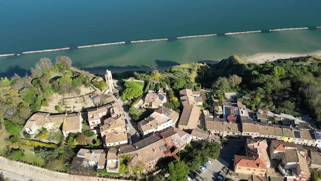 Aerial footage of the medieval coastal village of Fiorenzuola di Focara in Pesaro, Italy
