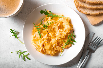 Scrambled eggs on white plate