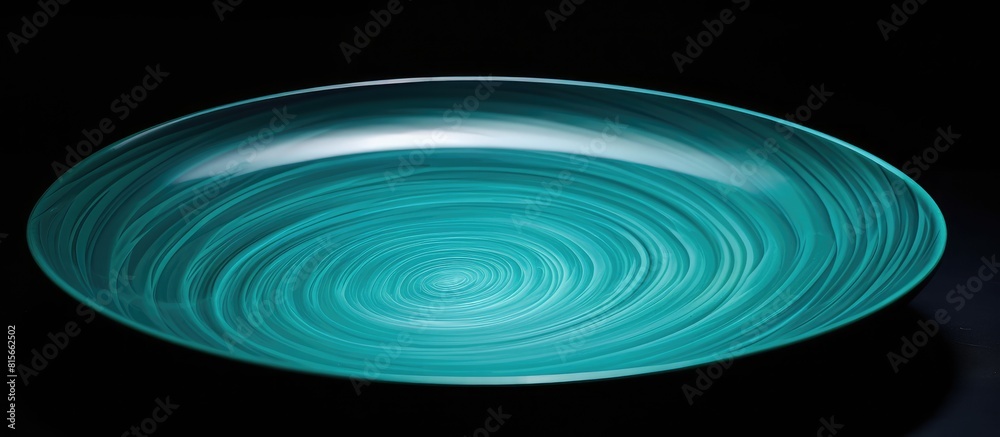 Aufkleber empty ceramic plate of delicate bed achuamarine turquoise color black background the top is blowing 