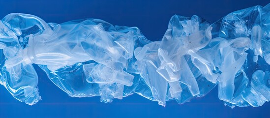 Obraz premium Disposable waste plastic on blue background Top view Copy space