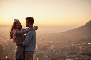 Couple, date and hug for cityscape sunset, outdoor view and bonding for love in relationship....