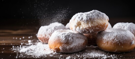 Sweet donuts with cinnamon sticks powdered with sugar Copy space