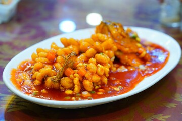 Succulent fillet of fish with a sweet and sour sauce served on a plate