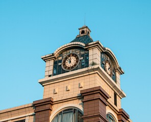Large clock tower in a corner of a shopping mall in Wuhan