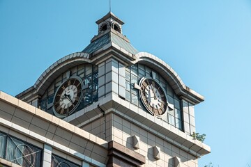 Large clock tower in a corner of a shopping mall in Wuhan