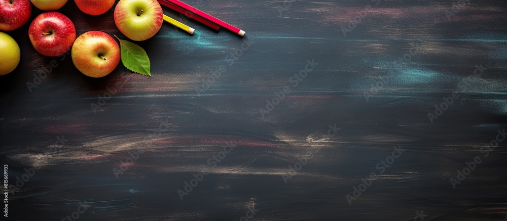 Aufkleber Colored pencil placed on chalkboard background with copy space for image or text