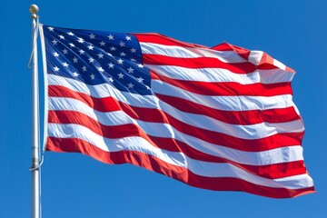 American flag fluttering proudly under clear blue skies on a beautiful sunny day
