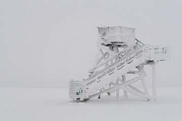 Look Out Tower in Saariselka, Finland in winter completely covered with snow