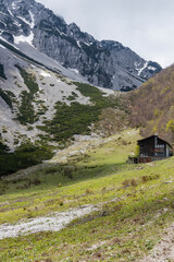 Begunjščica panorama of mountain trekking to the highest peak. View of the Alps, climbing with via ferrata. Distant view of Lake Bled from above. Sports holidays, life of adventure in the countryside.