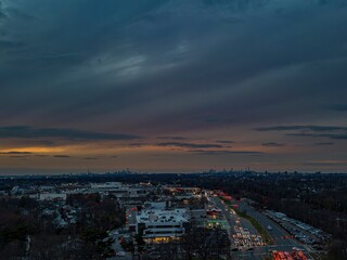sunset over the downtown skyline with cars in Long Island, NY