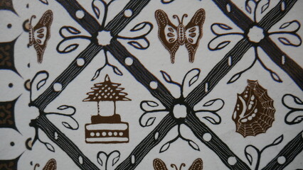 Texture, background, pattern. Cloth is black and white, with a brown pattern. 