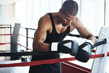 Tired, boxer and man in ring at gym for challenge, exercise or fail training competition for body...