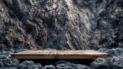 There is a wooden table or platform in front of a rocky cliff.

