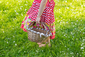 young Barefoot forager discovers wonders of forest floor with wicker basket in hand, Simple joys...