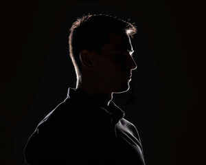 Mysterious silhouette against black background, super realistic