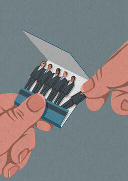 Hand removing businessman matchstick from matchbook