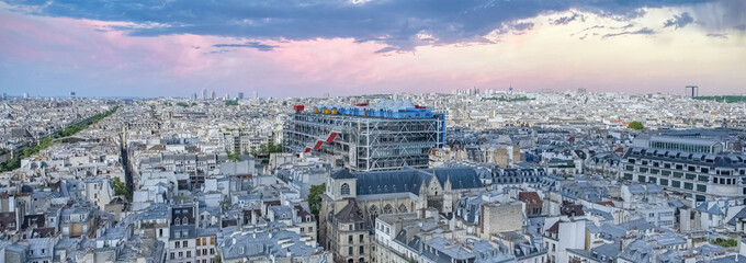 Aerial shot of the beautiful cityscape of Paris during the sunset