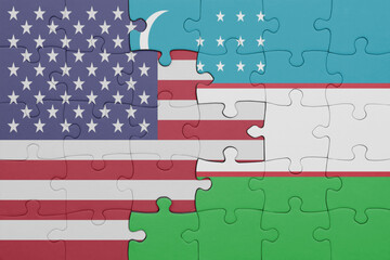puzzle with the colourful national flag of uzbekistan and flag of united states of america .