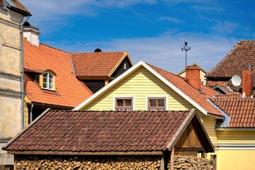 View of the tiled roofs of houses in the historical center of the city. Sunny weather.