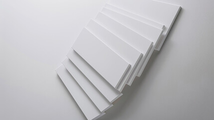 Obraz premium A gallery showcasing a staggered array of seven plain white frames, each shifted slightly to create a cascading visual effect.