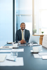 Portrait, business and smile of black man in office at table on laptop for corporate job in...