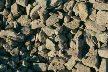 Granite gravel chips materials for the construction. Natural crushed granite gravel as a background. Industrial design