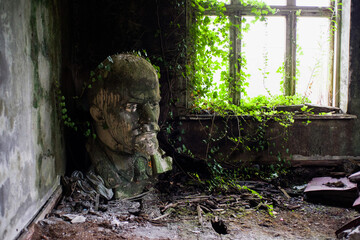 A damaged bust of Bolshevik leader Lenin in an abandoned cultural center in the Greek village of Dagva in the Kobuleti municipality. Close-up.