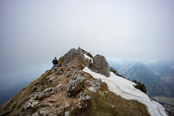 Begunjščica panorama of mountain trekking to the highest peak. View of the Alps, climbing with via ferrata. Distant view of Lake Bled from above. Sports holidays, life of adventure in the countryside