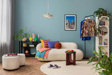 Modern and colorful interior of living room with design boucle sofa, mock up poster, shelf, plants,...