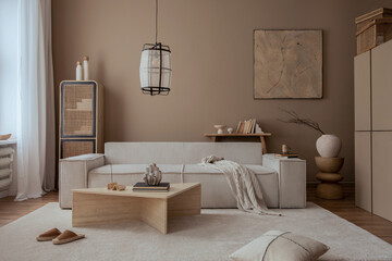 Elegant composition of warm living room interior with mock up poster frame, modular sofa,...