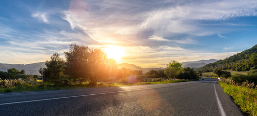 Mediterranean sea coast road into mountains horizon in summer with beautiful bright sun rays © AA+W