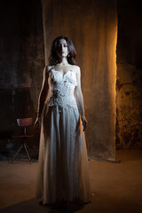 Elegant and beautiful brunette in chic evening dress or wedding dress,