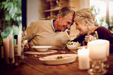 Senior, couple and dinner in home on date of anniversary in retirement with love in marriage....