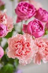 Bouquet of lilac roses and pink carnations. Close up