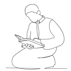 Muslim boy reads the Koran