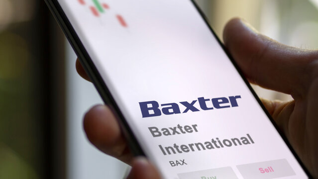 April 09th 2024 , Deerfield, Illinois. Close up on logo of Baxter International on the screen of an exchange. Baxter International price stocks, $BAX on a device.