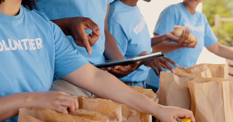 Volunteer, hands and team with tablet for food donation, community service and poverty support with...