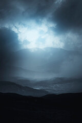 dark fantasy night landscape with mountain in fog