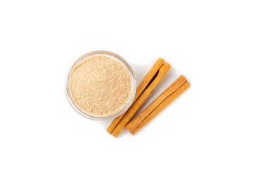 Cinnamon sugar isolated on white background. Homemade cinnamon sugar in a bowl on background. Brown sugar. Spice mixture for drinks and baking.