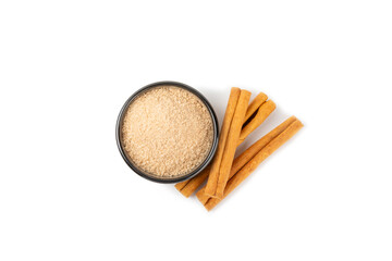 Cinnamon sugar isolated on white background. Homemade cinnamon sugar in a bowl on background. Brown sugar. Spice mixture for drinks and baking.