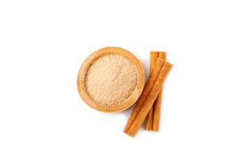 Cinnamon sugar isolated on white background. Homemade cinnamon sugar in a bowl on background. Brown sugar. Spice mixture for drinks and baking.