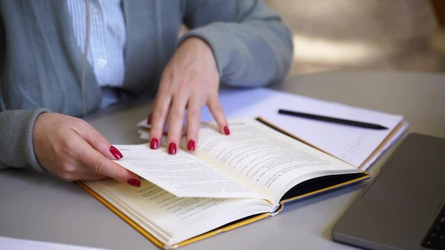 Middle aged woman scientist reading book write thesis in university library Mature student exercising in college Freelancer in coworking upgrading professional qualification