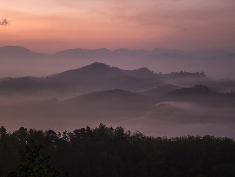 Sunrise scene with mountain and sea of mist on Southern of Thailand